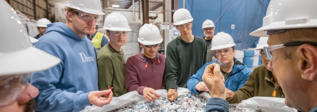 Agilyx employee and students in a chemical recycling facility.